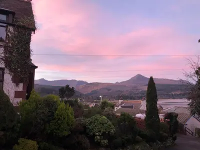 a view of a town with mountains in the background at Belvedere in Brodick
