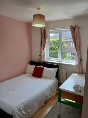 a bedroom with a white bed and a window at Urban Escape Glasgow Green Free Parking 20min walk to City Center in Glasgow
