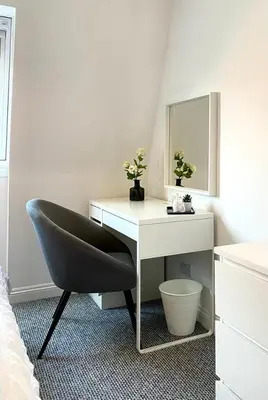 a bedroom with a desk and a chair and a mirror at 3 bedroom - 2 bathroom Townhouse in Corstorphine Near Murrayfield Stadium - Direct Bus To Edinburgh City Centre in 20 Minutes - Two Private Parking Spaces - Private Sunny Garden - Recently Refurbished in Edinburgh