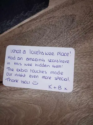 a piece of paper on top of a wooden floor at The Wee Bunker in Barassie