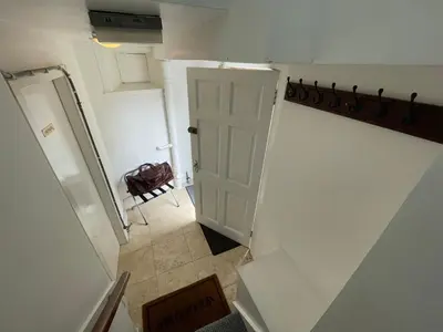 a view of a hallway with a door and a room at Little Limetree in Moffat