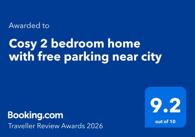 a screenshot of a phone with the words cozy bedroom home with free parking near at Cosy 2 bedroom home with free parking near city in Edinburgh