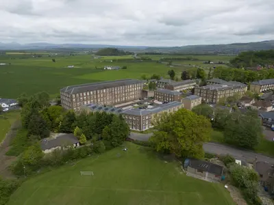 an aerial view of a building in a field at Mhuilinn Apartment in Stirling