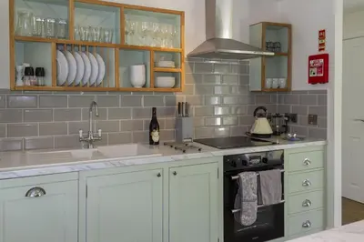 a kitchen with a sink and a stove at Skerrow in New Galloway