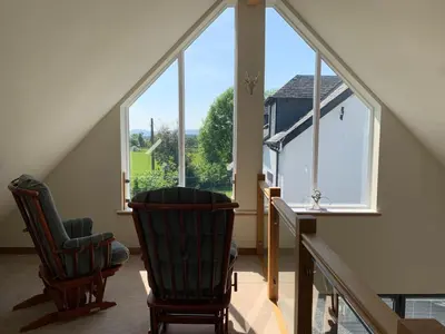 a room with two chairs and a large window at Newton Bothy in Stirling