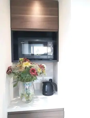 a vase of flowers sitting on a counter in a kitchen at The Wee Stay - Room Only - Rural 1 Bed Guest Suite in Middleton Fossoway