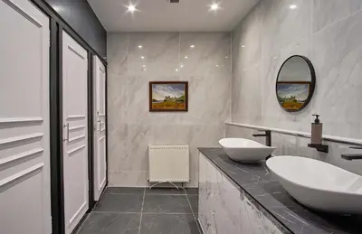 a white bathroom with a sink and a tub at Muthu Oban Regent Hotel in Oban