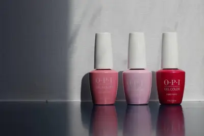 three bottles of nail polish sitting on a table at The Perle Oban Hotel & Spa in Oban