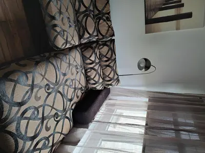 a room with a couch with a pattern on the floor at Apartment - Sleeps 4 - Pet friendly - Parking in Troon