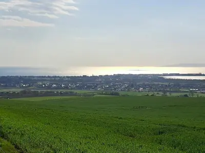 a green field with the ocean in the background at Apartment - Sleeps 4 - Pet friendly - Parking in Troon