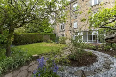 a garden in front of a brick building at The Lindsay House in Stirling