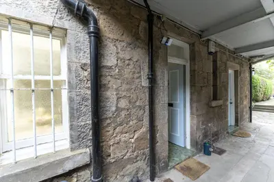 a pipe on the side of a brick wall at The Lindsay House in Stirling