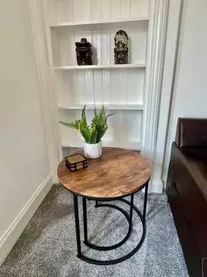 a table with a plant on it in a room at Large 2 bed near Glasgow Airport in Paisley