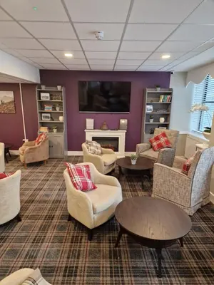 a large living room with couches and a fireplace at Britannia Inn Glasgow in Glasgow