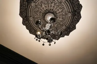 a chandelier hanging from a ceiling at Novana Aparthotel in Glasgow