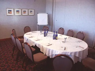 a conference room with a round table with chairs at Horizon Hotel in Ayr