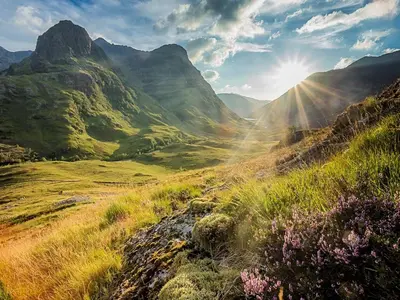 a view of a mountain valley with the sun shining at Bidean Lodge in Glencoe