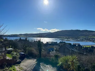 a view of a body of water with houses and a town at Campbeltown View in Campbeltown