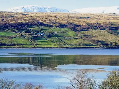 a view of a lake with mountains in the background at Rosmuire in Rhu