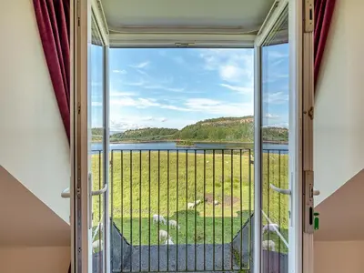 a view from the door of a room with a window at Kestrel Cottage - 27937 in Stirling