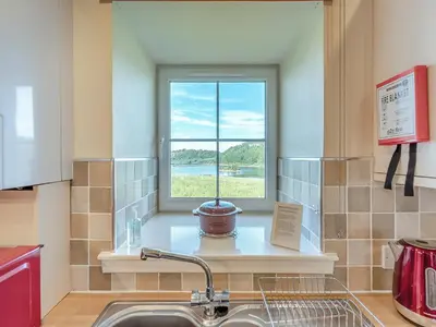 a kitchen with a window and a sink at Kestrel Cottage - 27937 in Stirling