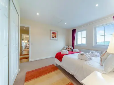 a bedroom with a bed and a window at Osprey Cottage- 27939 in Stirling