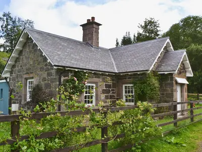 an old stone house with a fence at Westerton Lodge - Srrh in Crieff