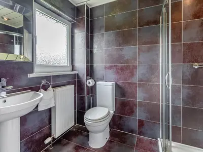a bathroom with a toilet and a sink at Tigh Na Beannaich in Powmill