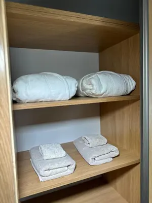 two towels and a pillow in a closet at Gleneagles Holiday Home Rental in Auchterarder