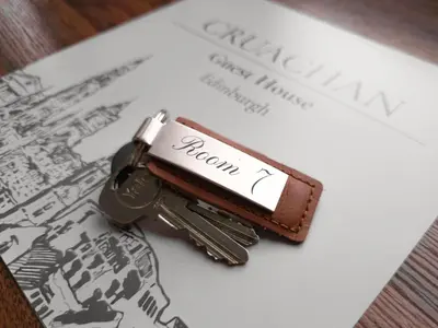 a key sitting on top of a paper at Cruachan Guest House in Edinburgh