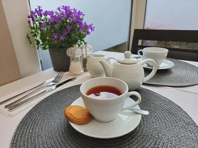a cup of tea and biscuits on a table at Cruachan Guest House in Edinburgh