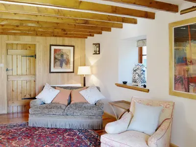 a living room with two chairs and a couch at Arkland Mill in Corsock