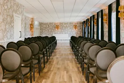 a room with rows of chairs and a table at Marine Troon in Troon