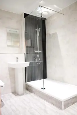 a bathroom with a shower and a sink at Maltings Hotel in Dunfermline