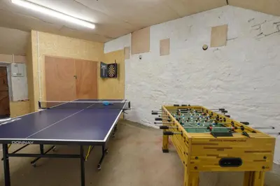 a ping pong room with a ping pong table at Achalic Farm House in Lerags