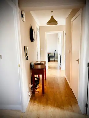 a hallway with a desk and a table in a room at 3 Bedroom harbourside apartment, Queensferry, 10 miles from Edinburgh in Queensferry