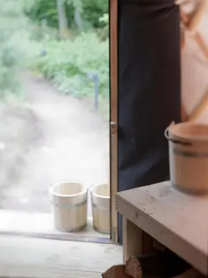 two buckets sitting on a table next to a window at Eastside Steading - Family barn in the Pentland Hills, Edinburgh in Penicuik