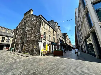 an old stone building on a cobblestone street at City Centre Hidden Hideout for 2 in Edinburgh