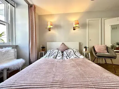 a bedroom with a large bed in a room at City Centre Hidden Hideout for 2 in Edinburgh