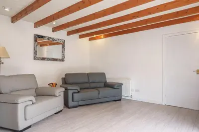 a living room with two chairs and a couch at Morton Cottage in Thornhill