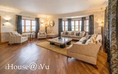a living room with a couch and a table at The Hoose at The Vu in Bathgate