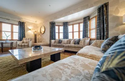 a living room with a couch and a table at The Hoose at The Vu in Bathgate