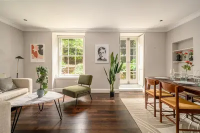 a living room with a couch and a table at New Town Garden Retreat by Calton Living in Edinburgh
