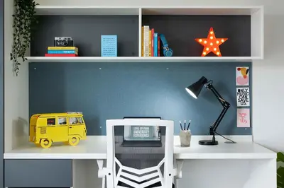 a desk with a yellow toy van on a shelf at Argyl - Westfield Summer Budget Accommodation, Adults Only in Edinburgh