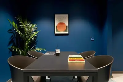 a black table with chairs and a book on it at Argyl - Westfield Summer Budget Accommodation, Adults Only in Edinburgh