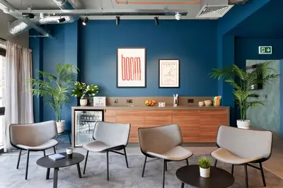 a waiting room with blue walls and chairs at Argyl - Westfield Summer Budget Accommodation, Adults Only in Edinburgh