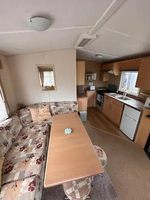 a living room with a couch and a table at 4-Bedroom Cosalt Located in Uddingston, Glasgow at Maryville Caravan Site in Uddingston