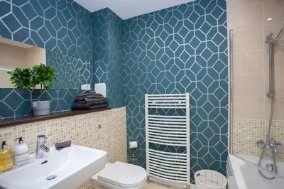 a bathroom with a toilet and a sink and a shower at 1 Bedroom Apartment in Very Central Location in Glasgow