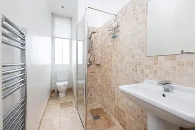 a bathroom with a sink and a toilet at Tasteful 1-bedroom Apartment near Edinburgh Meadows in Edinburgh