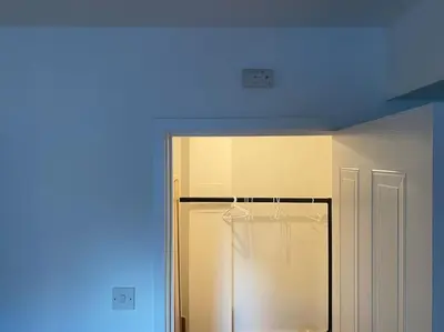 a room with a blue light on the ceiling at Perfectly situated luxury 2 bedroom apartment in Glasgow